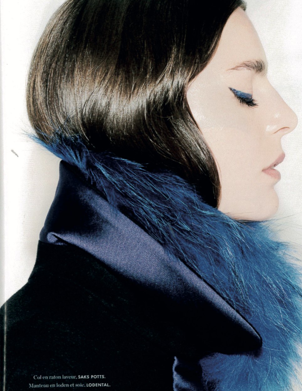 ELLE page: a model in profile, a loden and silk coat with a blue fur collar
