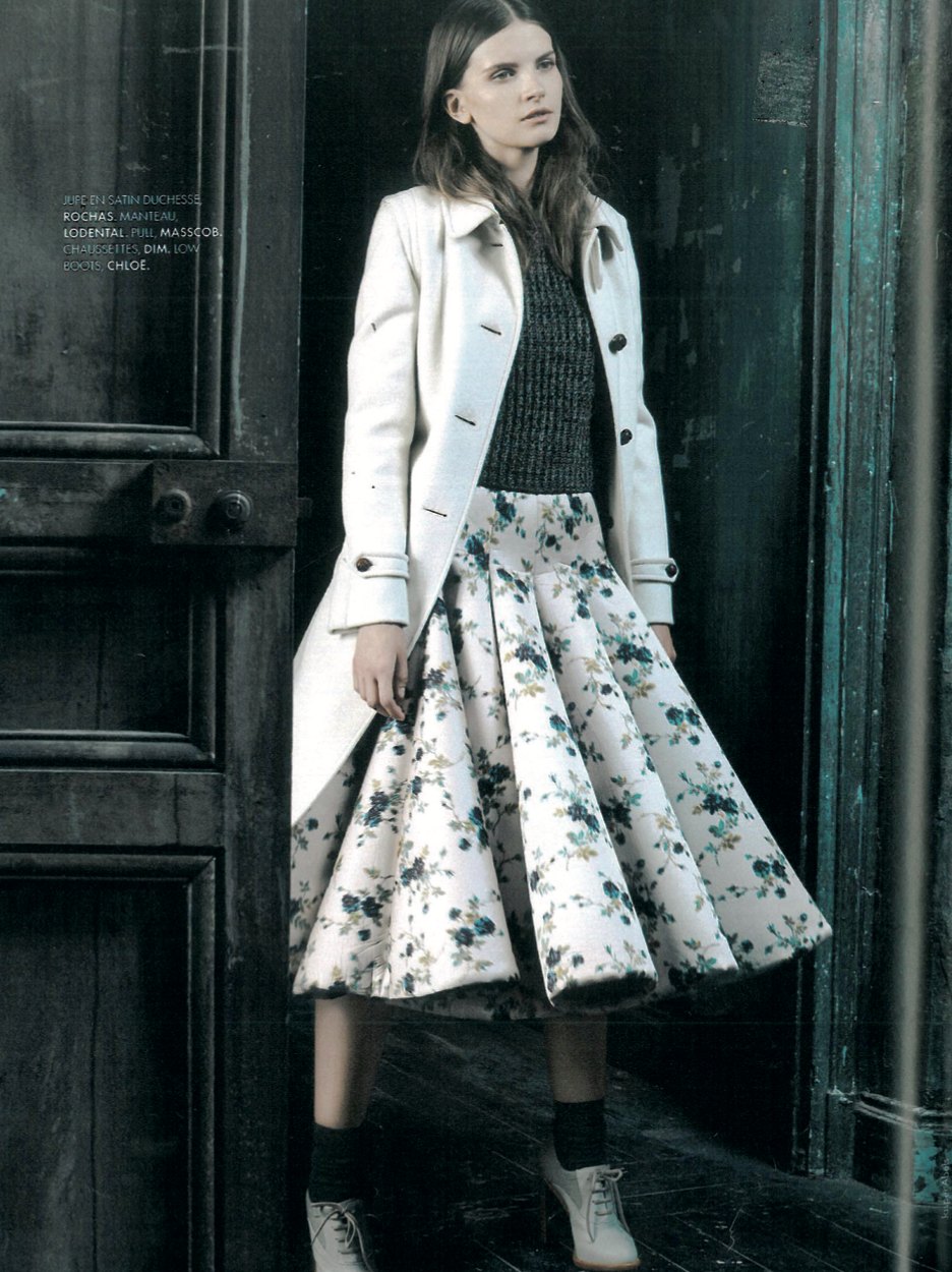 ELLE page: a model in a white LodenTal coat and a floral skirt