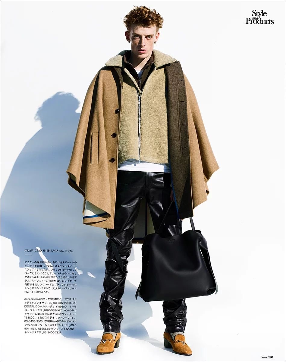 Sense magazine page: a young man in a camel loden poncho over a shearling jacket, with a black leather bag
